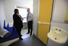 A member of the prison staff shows committee member Alison McInnes MSP a cell waiting to be occupied during a Justice Committee visit to HMP Addiewell. 